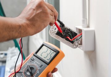 Electrician Is Using A Digital Meter To Measure The Voltage At T Electrician Is Using A Digital Meter To Measure The Voltage At T
